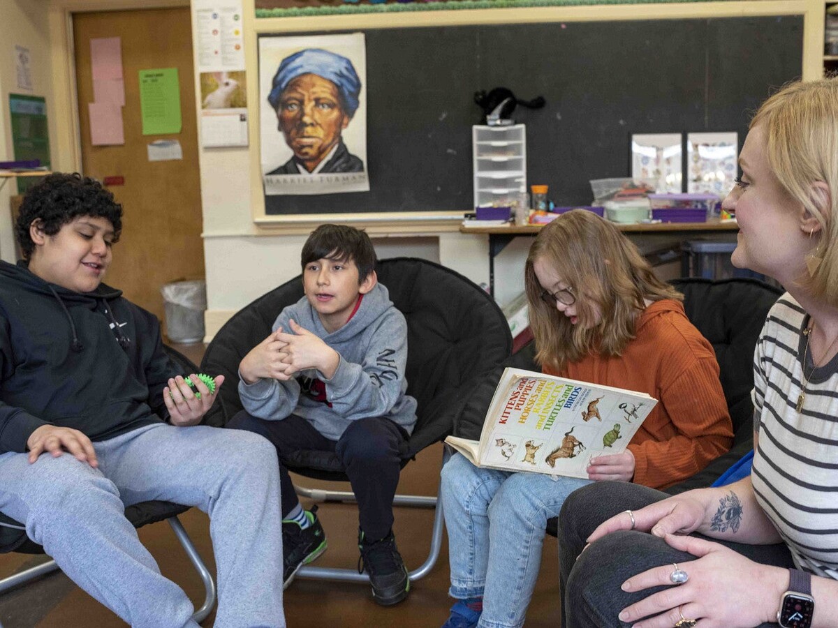 Students sit together during a classroom discussion.