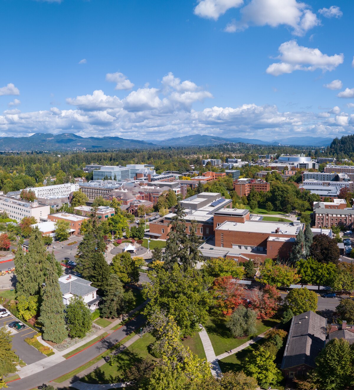 An aerial view of the University of Oregon campus and surrounding hills.
