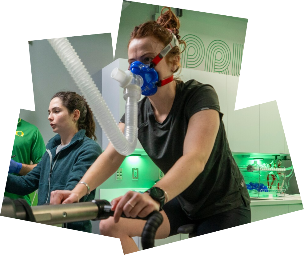 Researchers monitor an athlete cycling in the Oregon Performance Research Lab.
