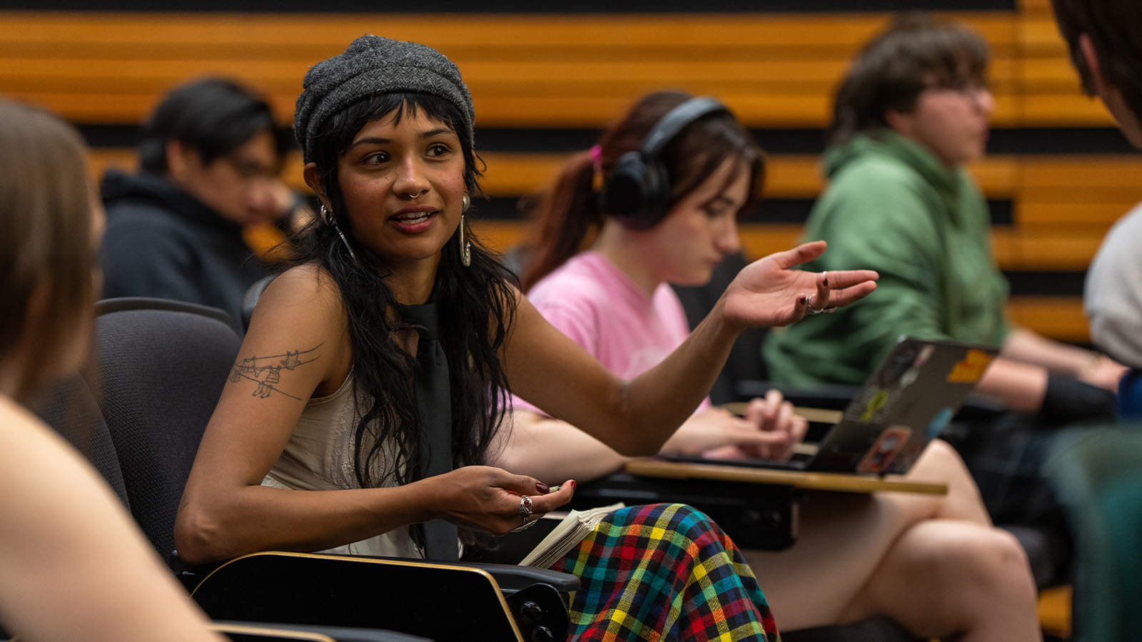 A student attends a design class lecture in Lawrence Hall.