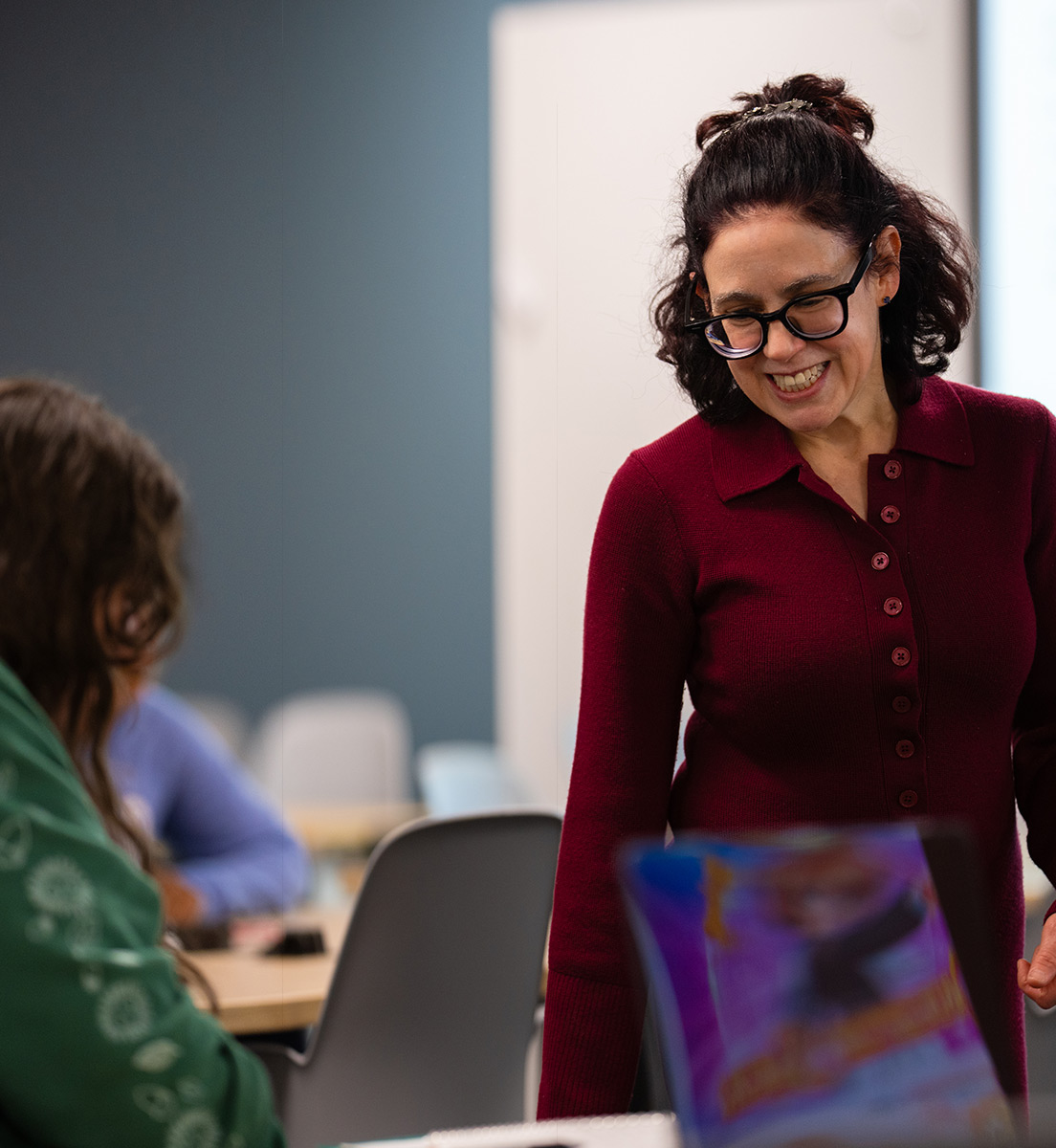 faculty member talking with student