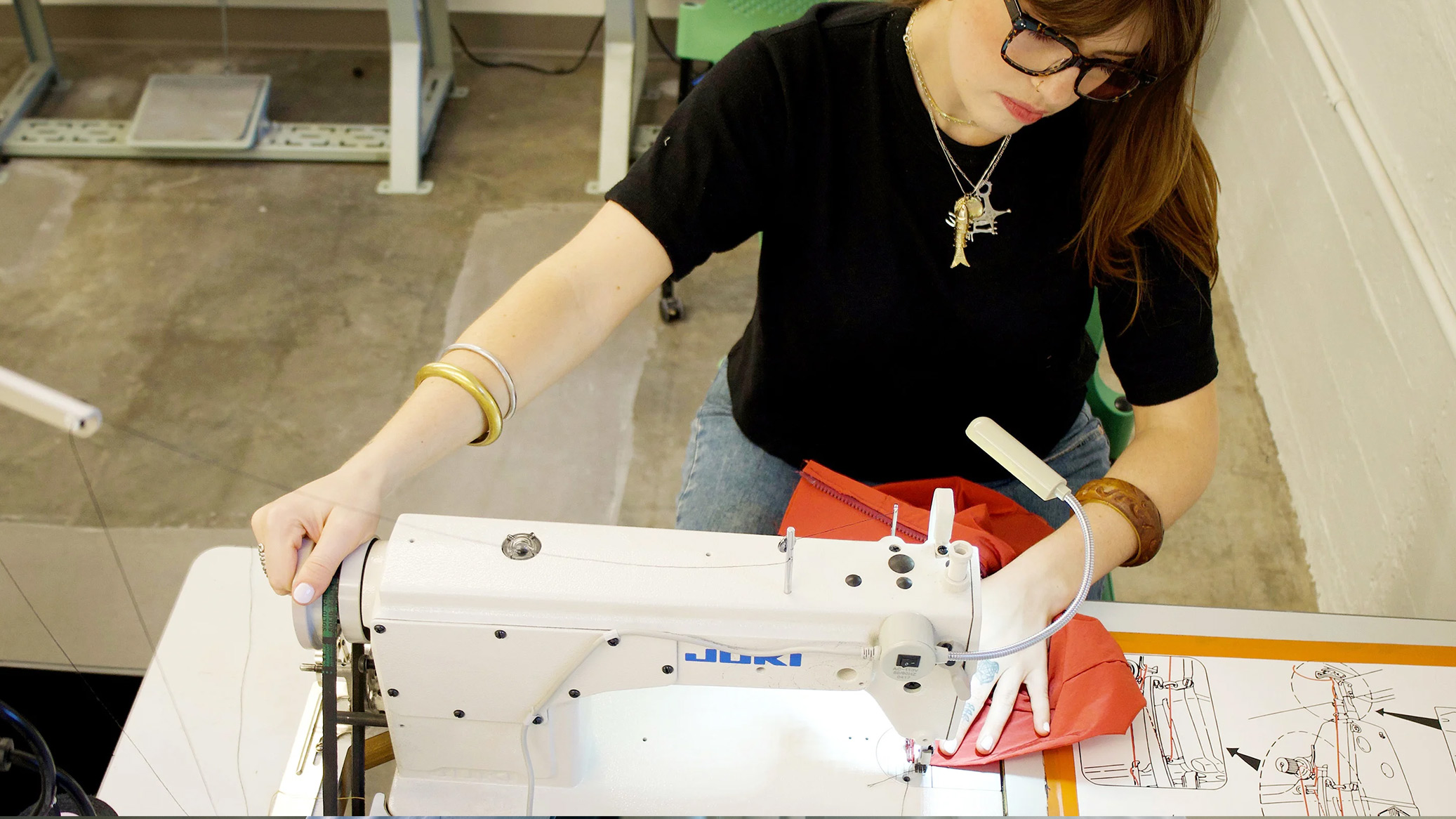 Student sewing Merino wool