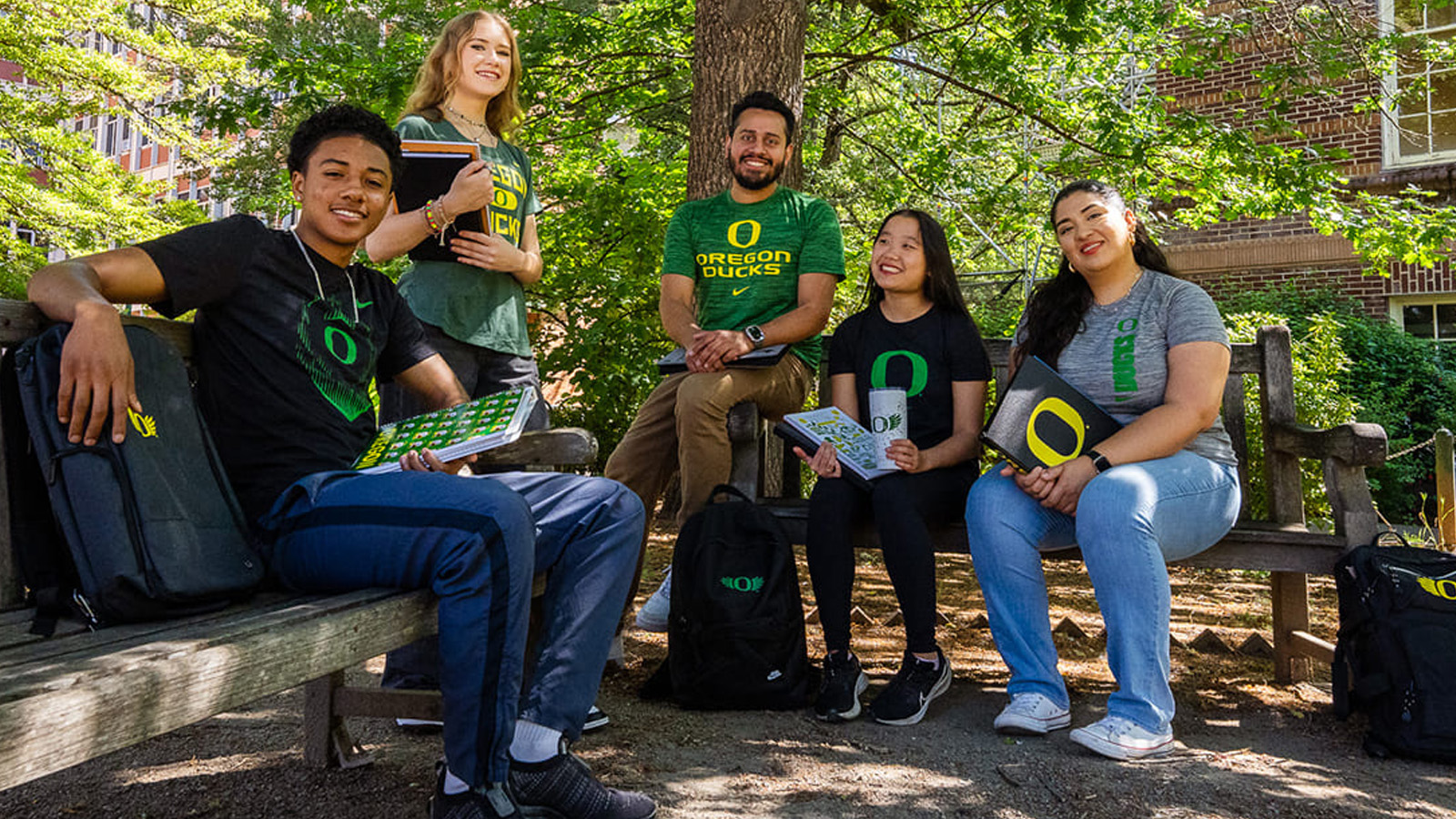 group of students sitting on benches
