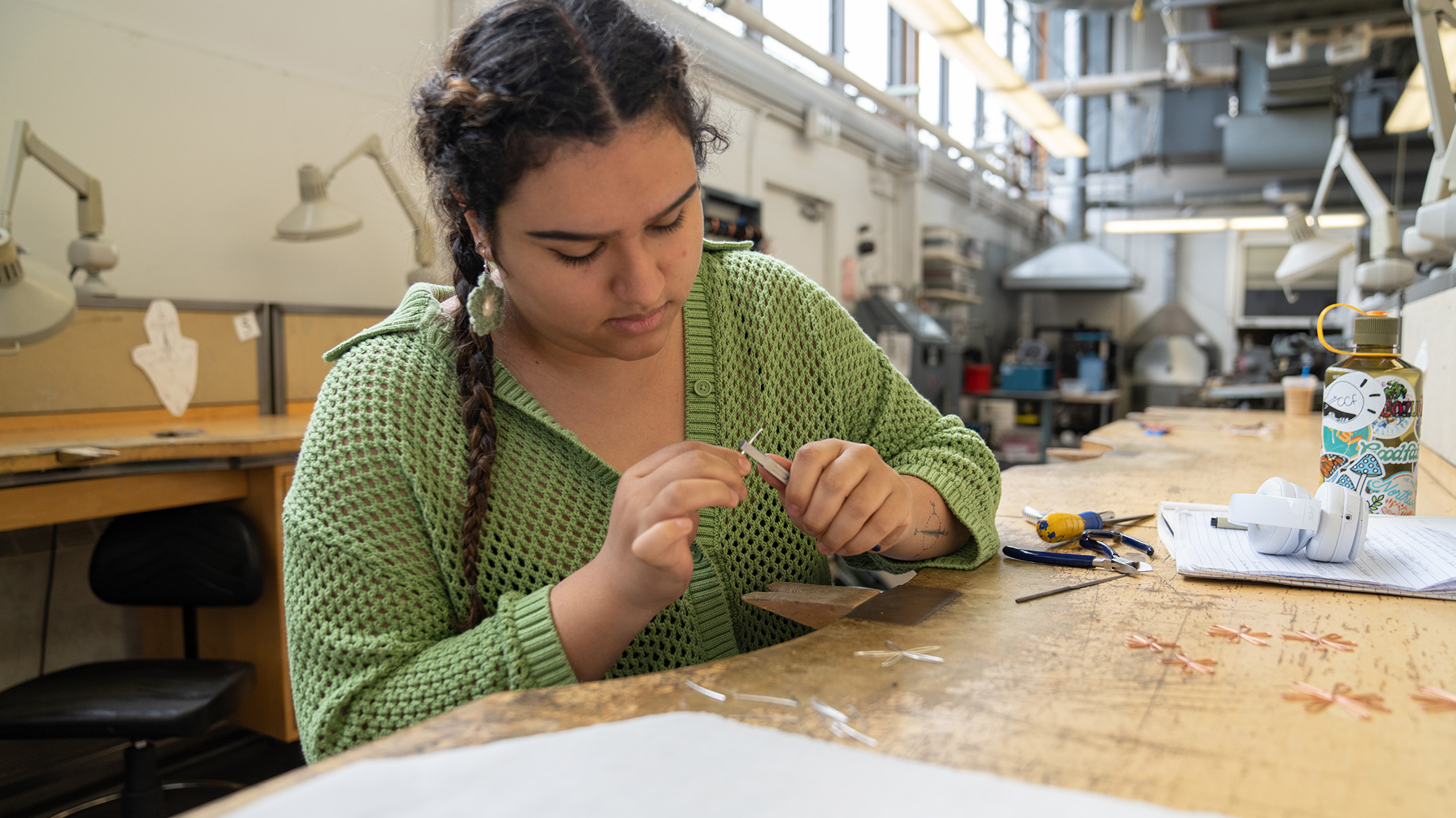 A student works in the Metalsmithing studio