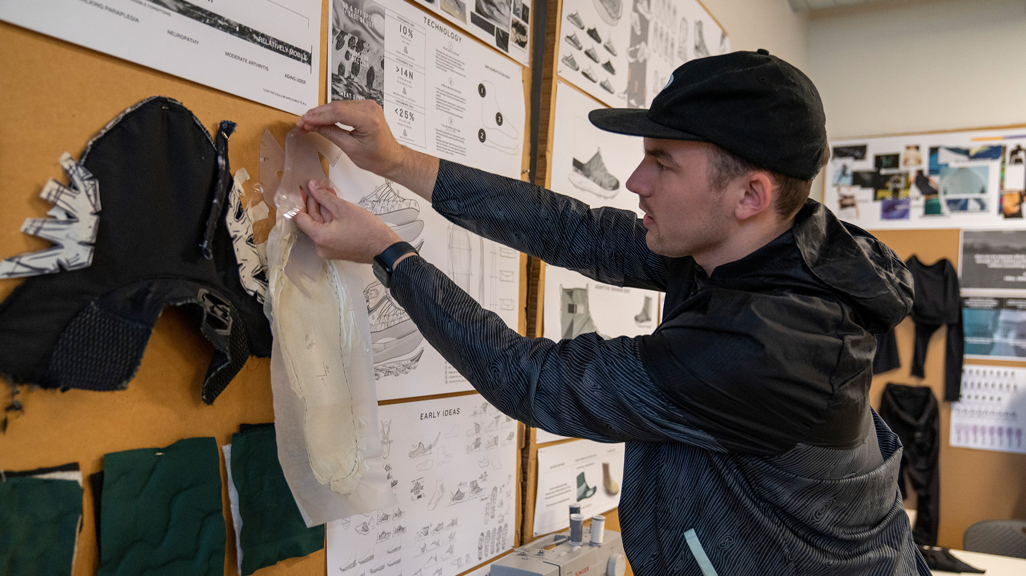 A Product Design student works in a studio