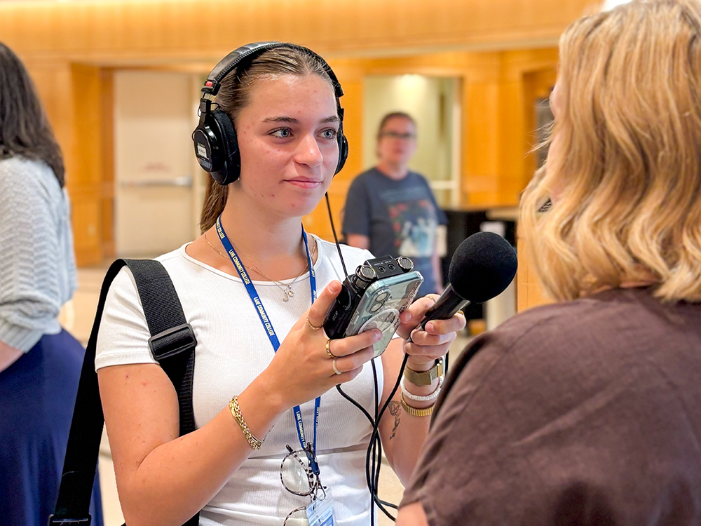 Student interviewing a subject