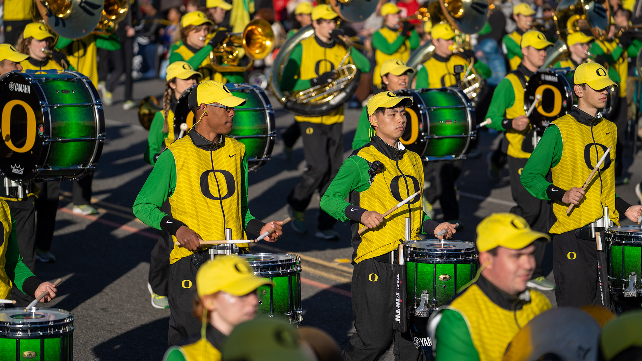 Oregon marching band performing in green and yellow