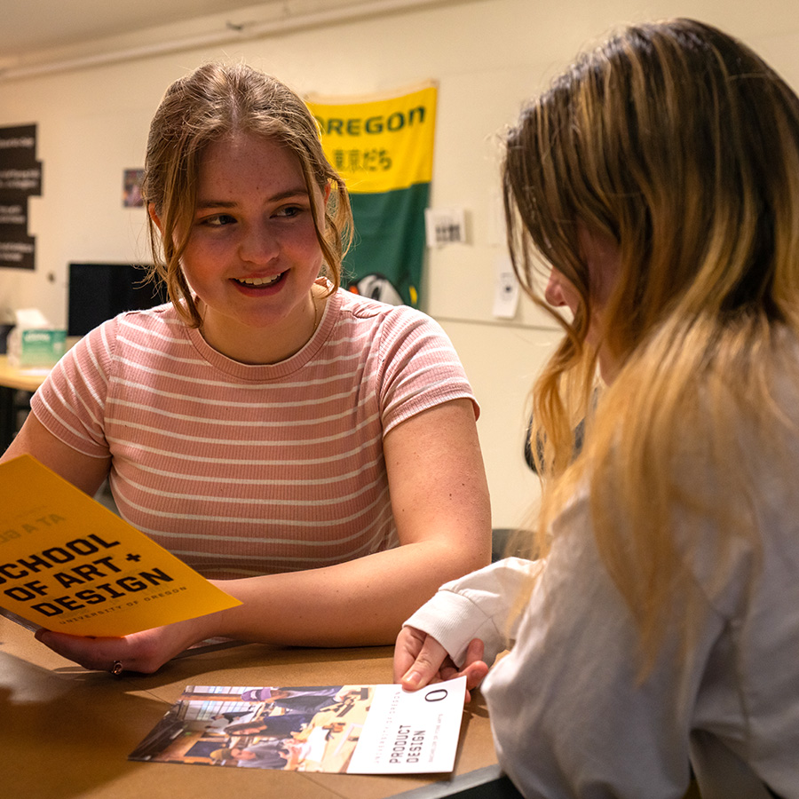 an academic advisor helps a student with questions