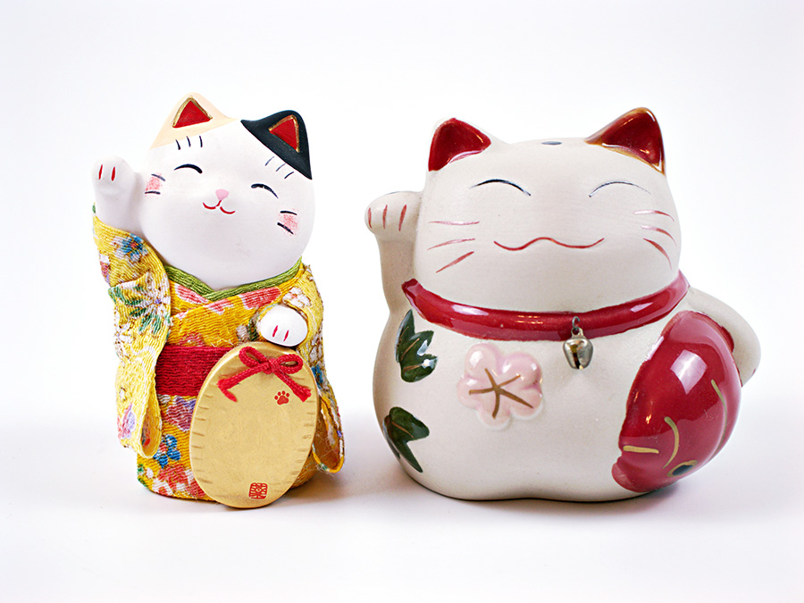 Lucky japanese cat souvenir ,maneki neko happy cat isolated on white background