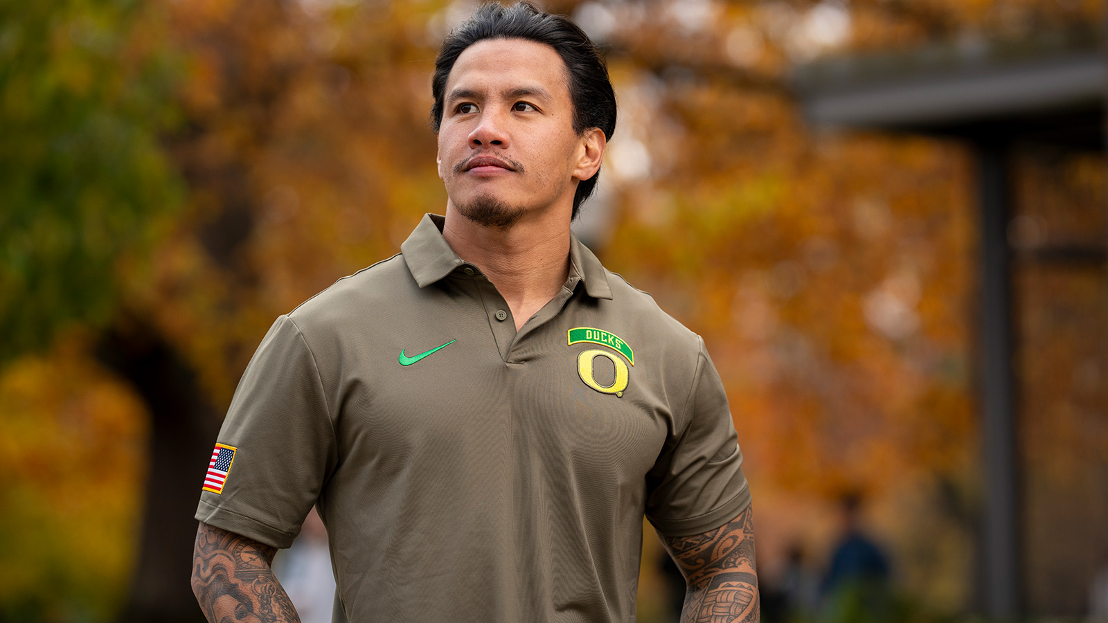 A student veteran proudly wearing a UO branded shirt 