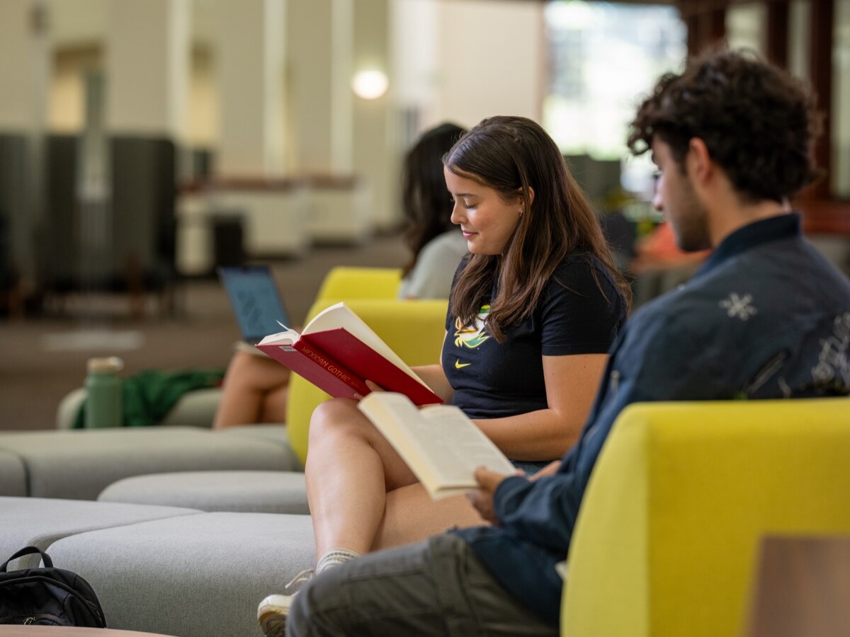 Students study inside Knight Library.