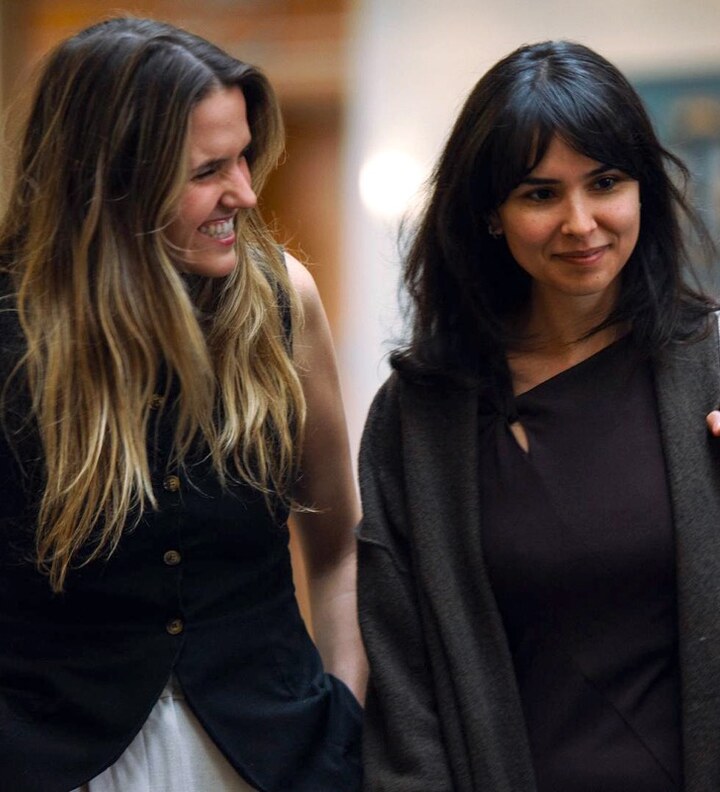 Two law students pose together.