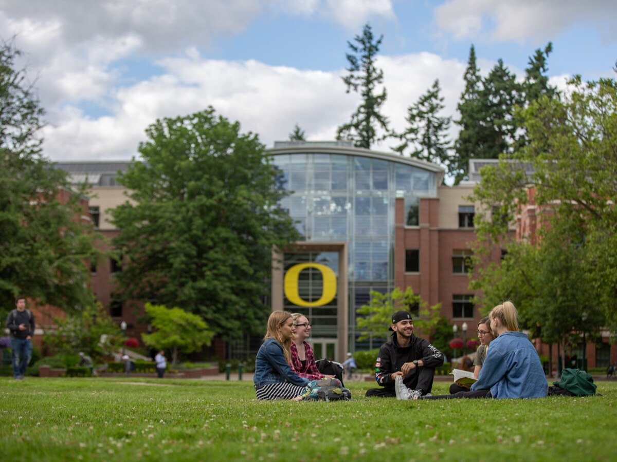 Students gather on the lawn outside Lillis Hall.