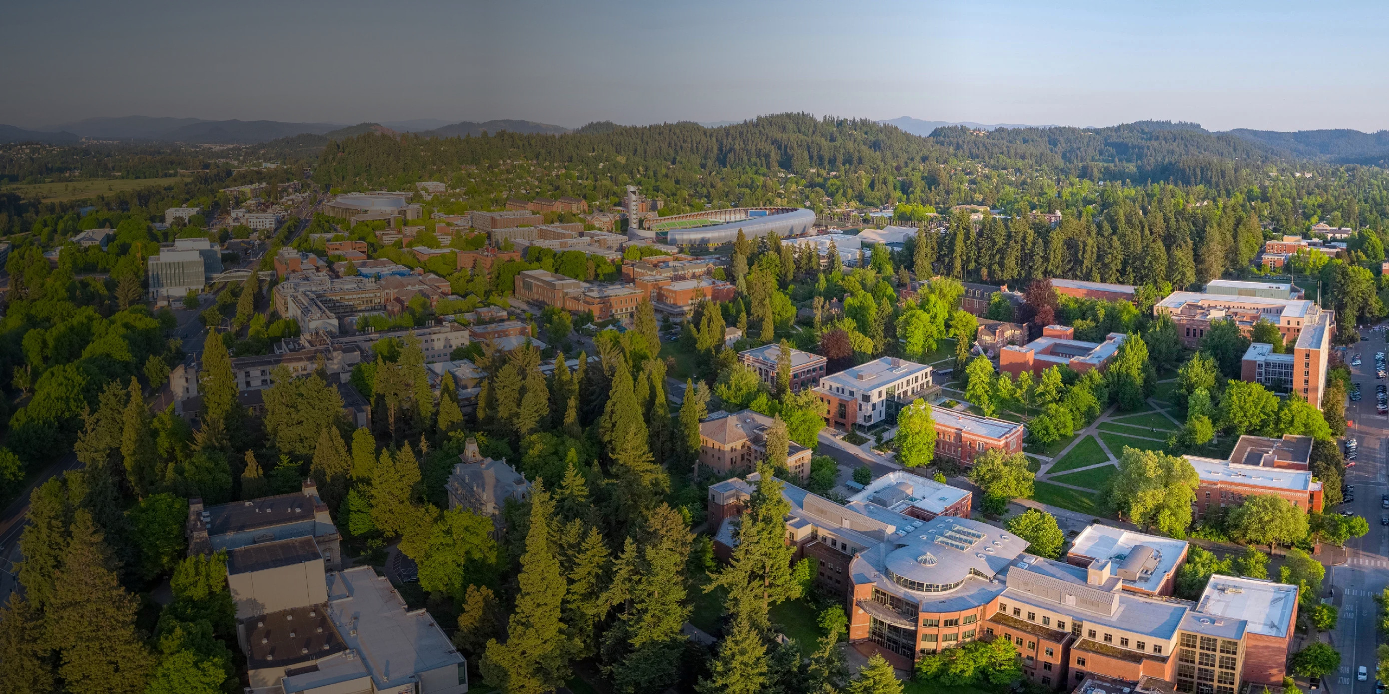 Aerial view of the University of Oregon campus in evening light.