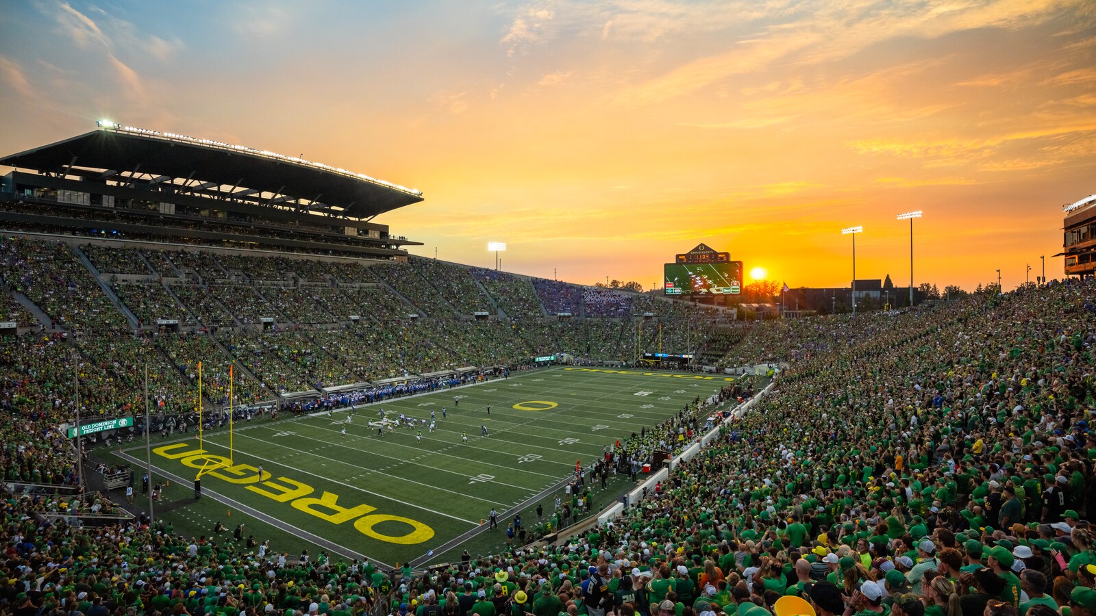 Oregon fans cheer during a football game at Autzen Stadium.