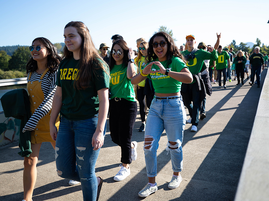 Oregon fans walk toward Autzen Stadium before a game.