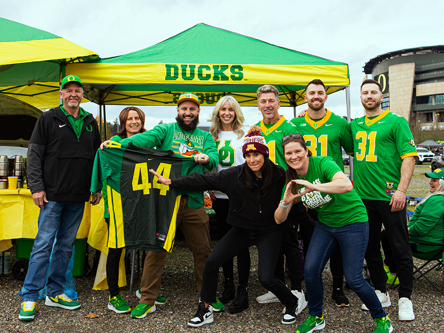 Oregon fans gather in the Autzen Stadium parking lot before a football game.