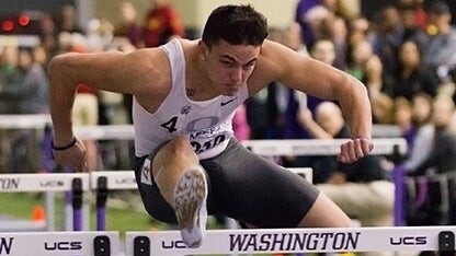 Devon Allen clears a hurdle.