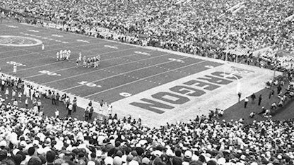 Fans fill a stadium during an Oregon football game.