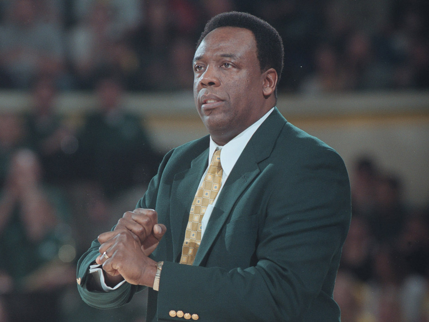 Ernie Kent coaches from the basketball sideline.