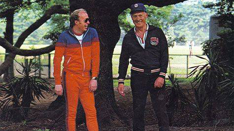 Early photo of Phil Knight standing next to Bill Bowerman