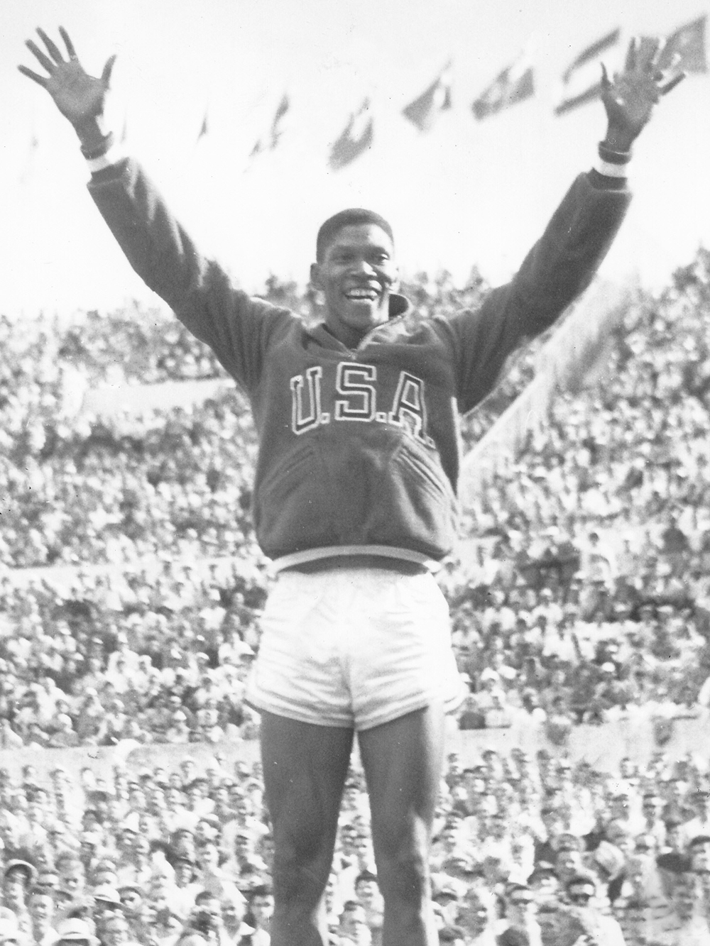 Otis Davis raising his hands at the Olympics