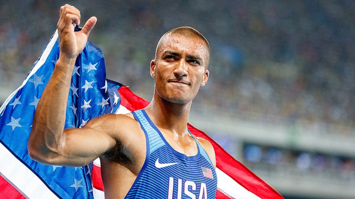 Ashton Eaton holding an American flag