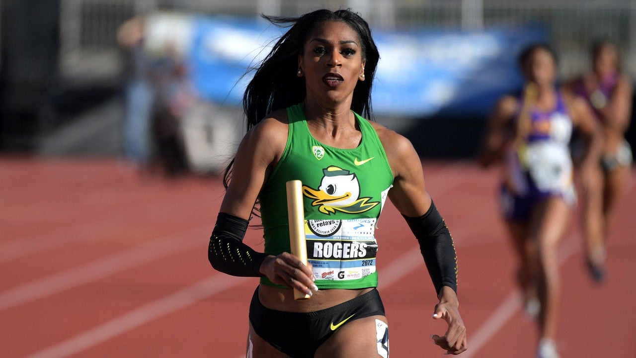 Raevyn Rogers running on a track