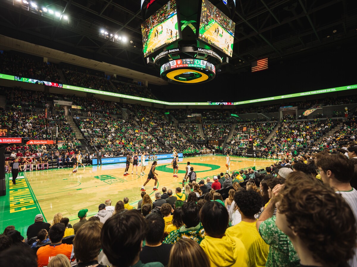 Fans watch an Oregon basketball game at Matthew Knight Arena.