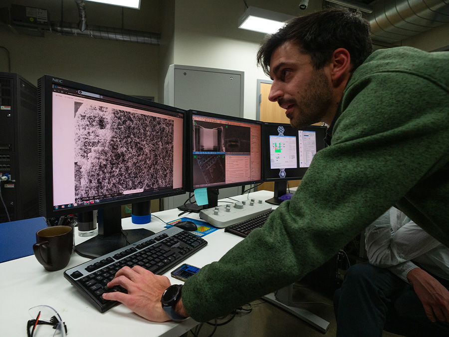 undergrad research student working on computer