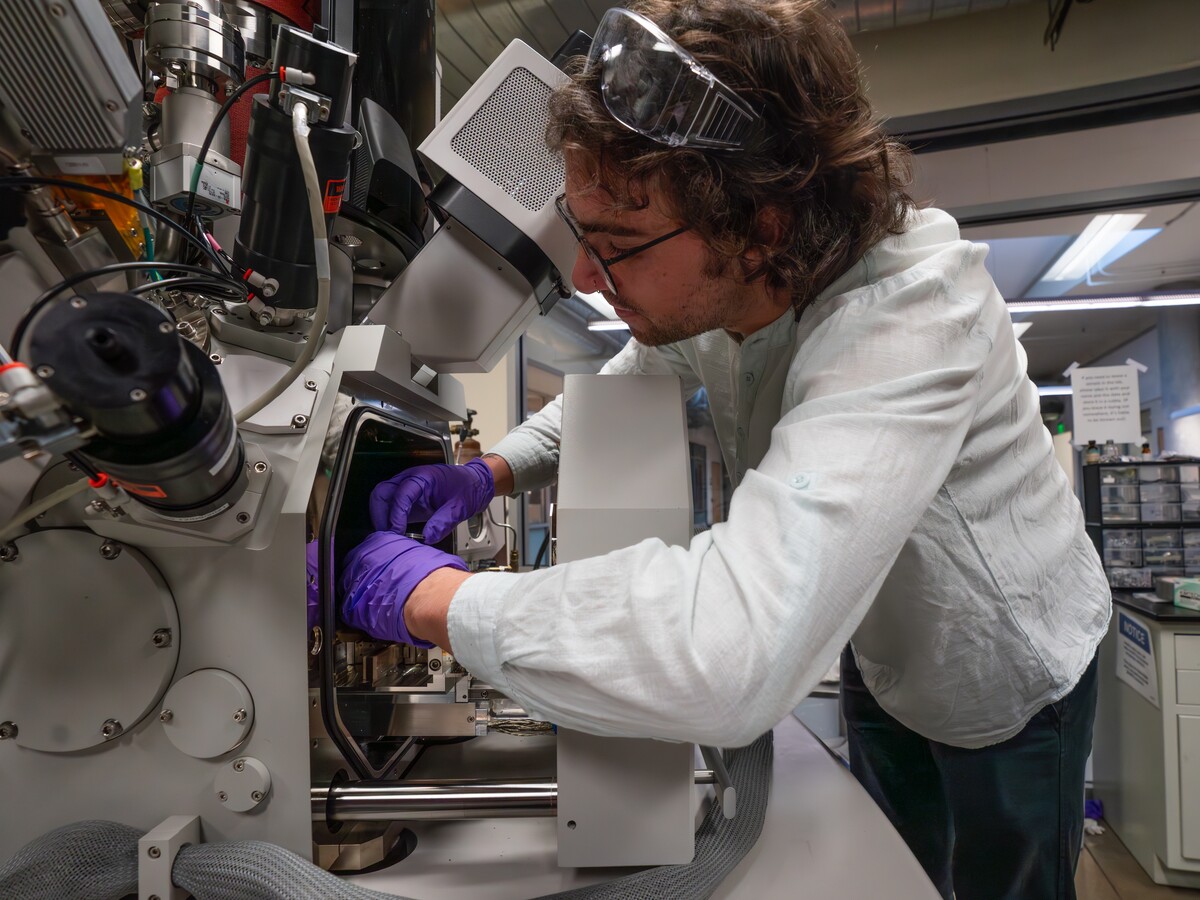 A researcher works with a scanning electron microscope.