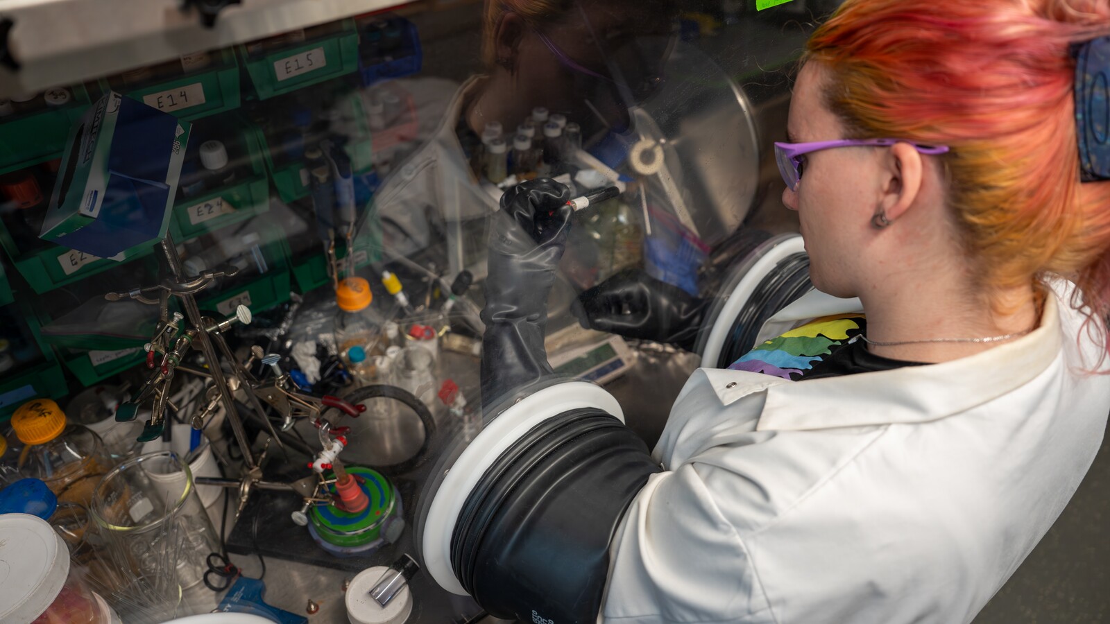 Researchers work in Carl Brozek’s chemistry laboratory.