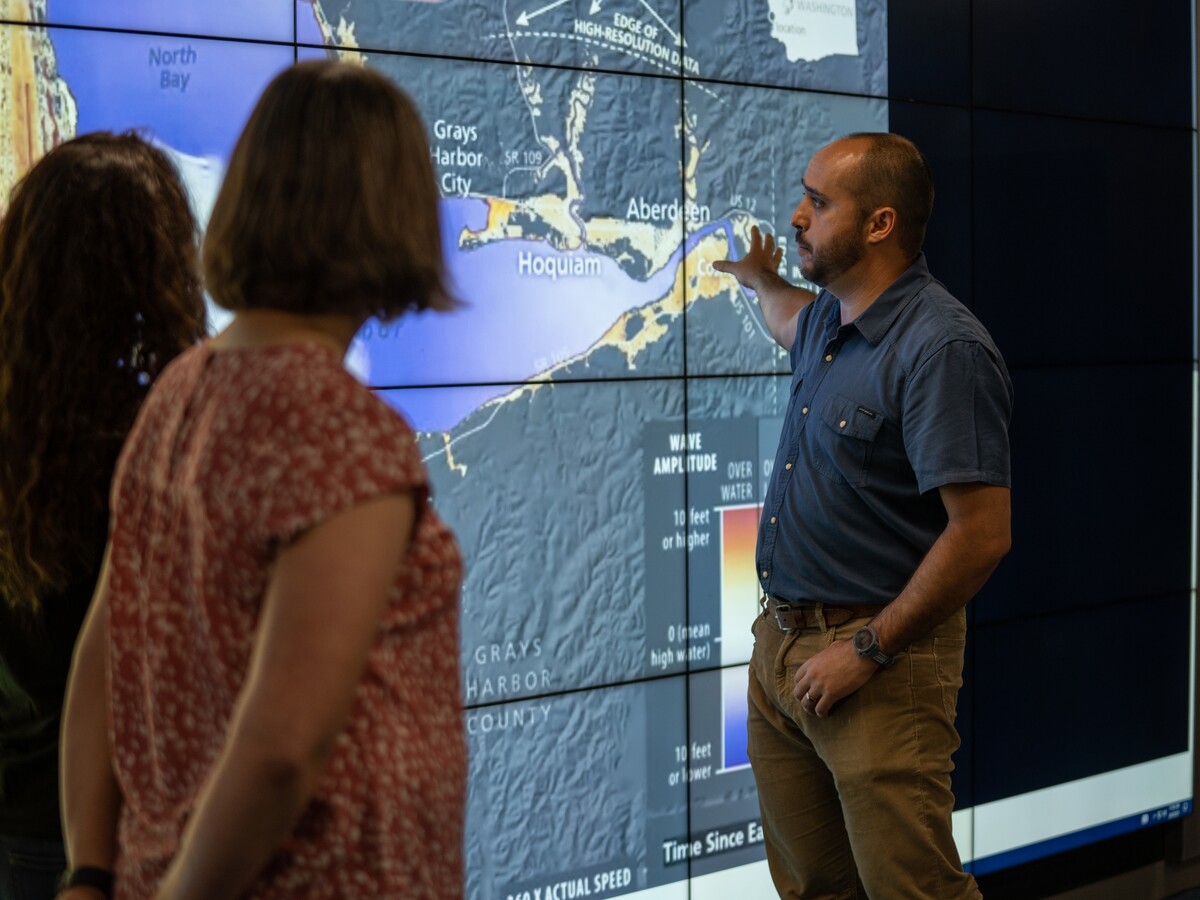 Researchers review a tsunami and earthquake hazard map of the Oregon and Washington coast.