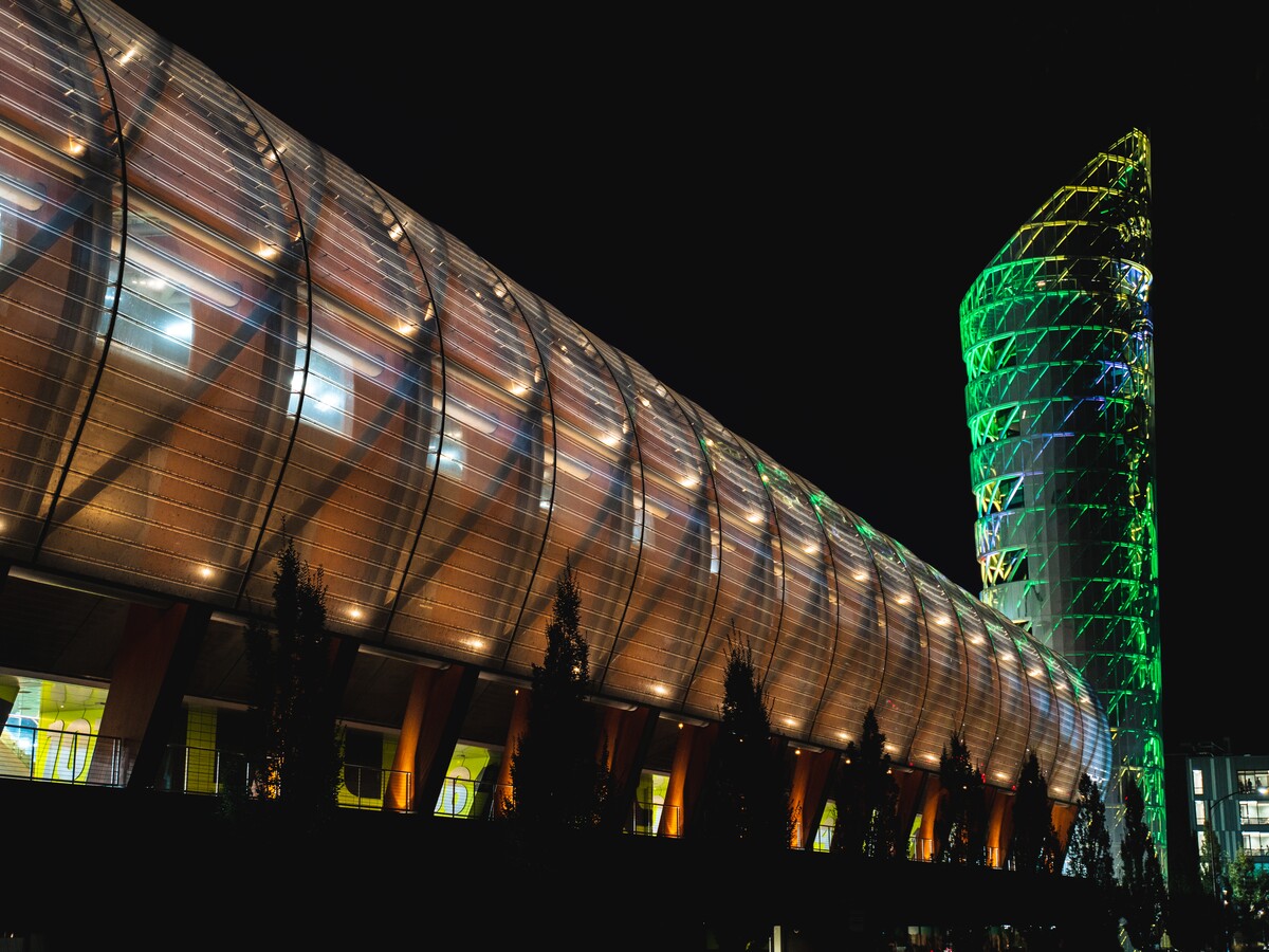 Hayward Field and its tower glow at night.