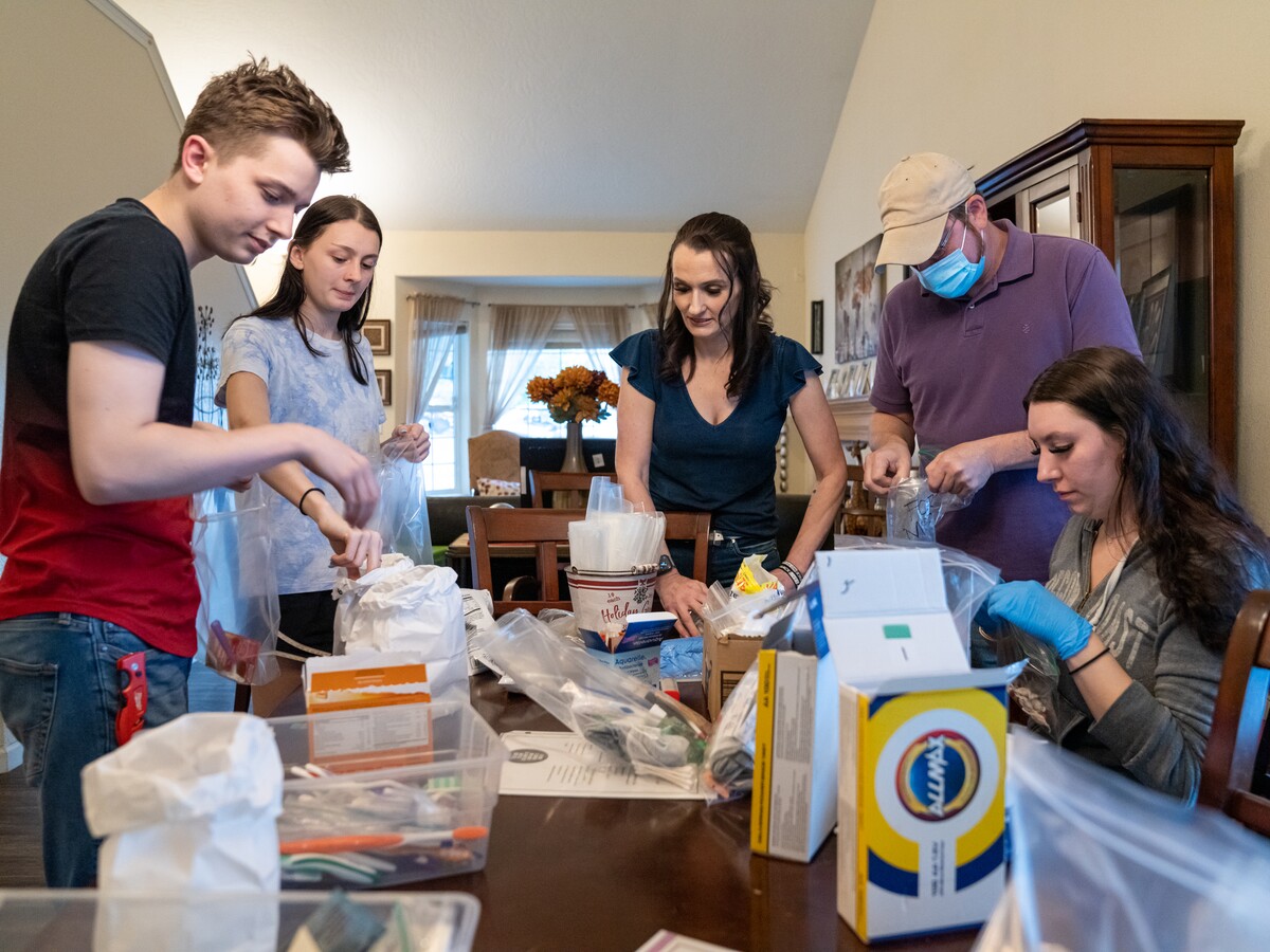 Volunteers sort donated supplies for CAHOOTS.