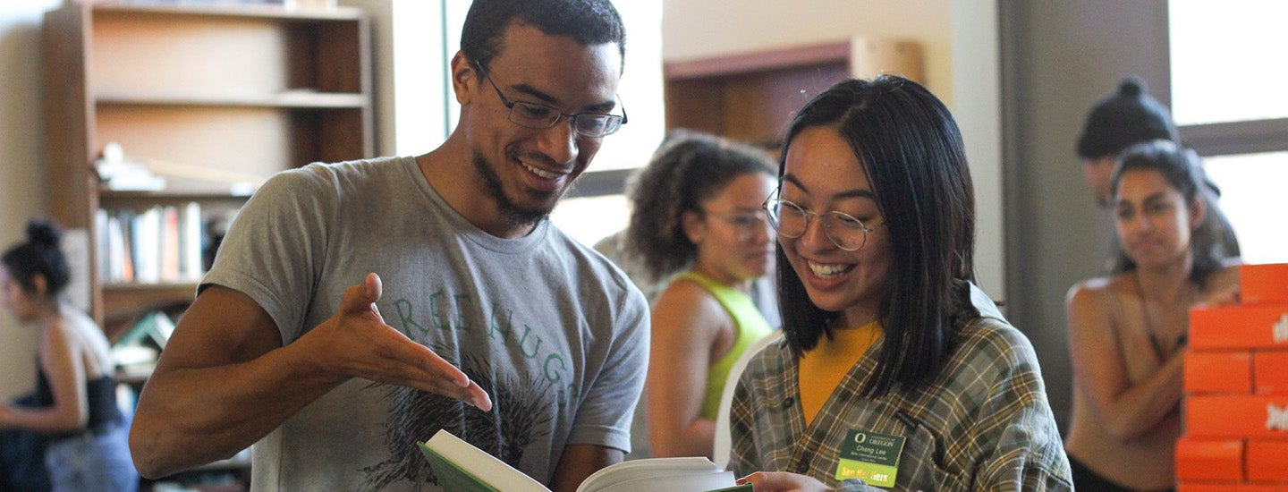 Students share a book at the Multicultural Center.