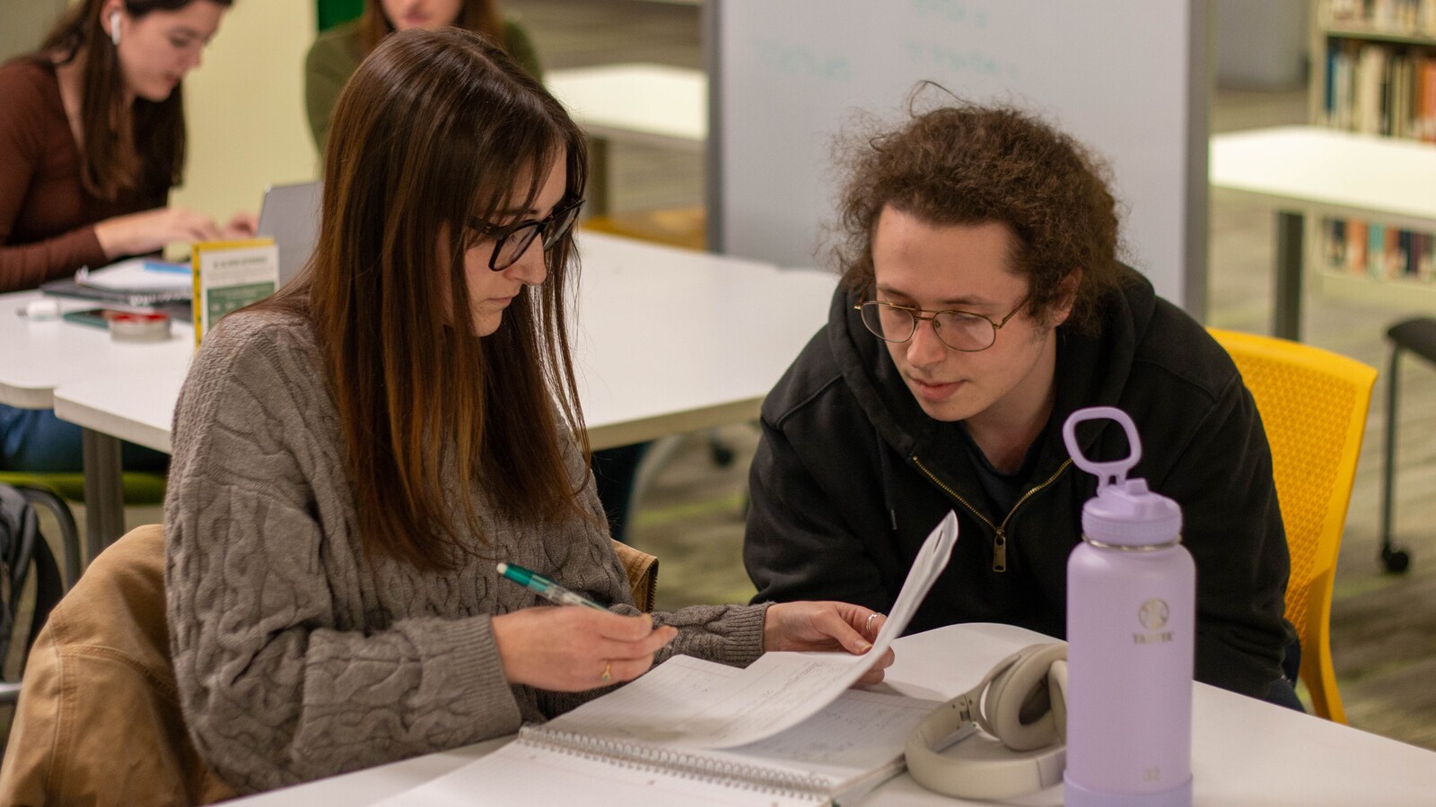 Students study and talk together on campus.