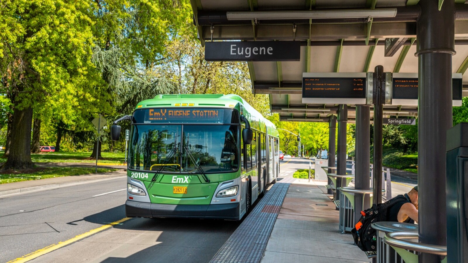 An EmX bus stops at a station in Eugene.