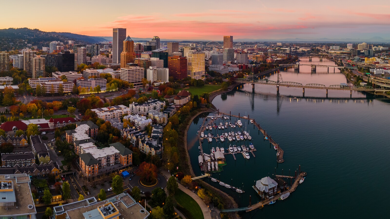Portland's downtown skyline and the Willamette River at sunset.