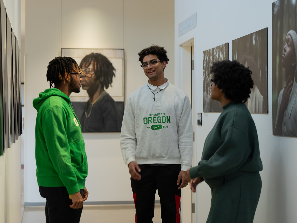 Three students talk in the Black Cultural Center.